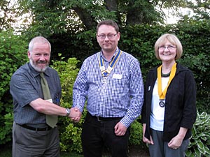 Past Pres. Martin handing over to new Pres. Richard, with Pres. elect for 2014, Sheena.